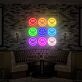 Neun Smileys im Raster als LED-Neonschild