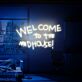 Brighten Your Bar, Office, and Home Décor with the "Welcome To The Madhouse" LED Neon Sign - The Perfect Moving Gift for Any Space!