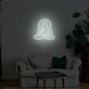 Abstraktes LED Neonschild mit meditierender Figur im Lotus Sitz für ruhige moderne Wanddekoration