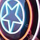 Abstraktes LED Neonschild mit Sternmotiv und geometrischen Kreisen als moderne Wanddekoration