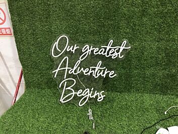 Light Up Your New Chapter: Our Greatest Adventure Begins White LED Neon Sign for Weddings, Home Decor, and Celebratory Events.