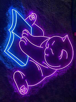 Brighten Your Reading Nook and Library with the Cozy Glow of the Cat Book LED Sign - Perfect for Animal Lovers and Decor Enthusiasts Alike.
