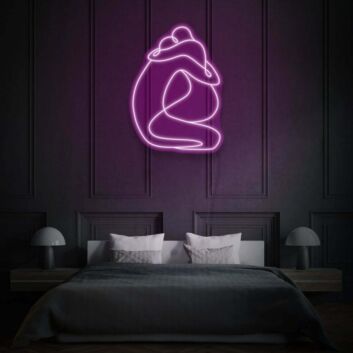 Sitzendes Paar in Umarmung LED-Neonschild
