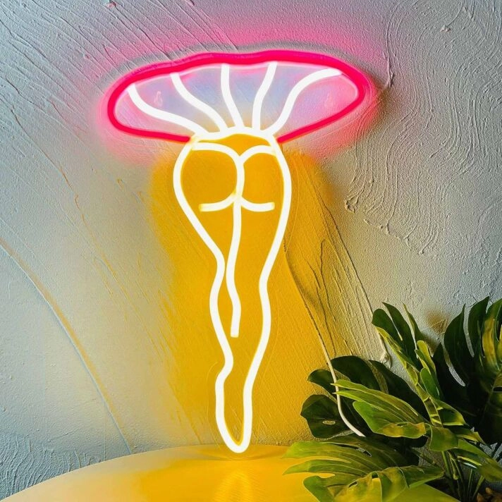 Abstraktes LED Neonschild in organischer Form mit pflanzeninspirierter Silhouette als moderne Wanddekoration für stilvolle Innenräume
