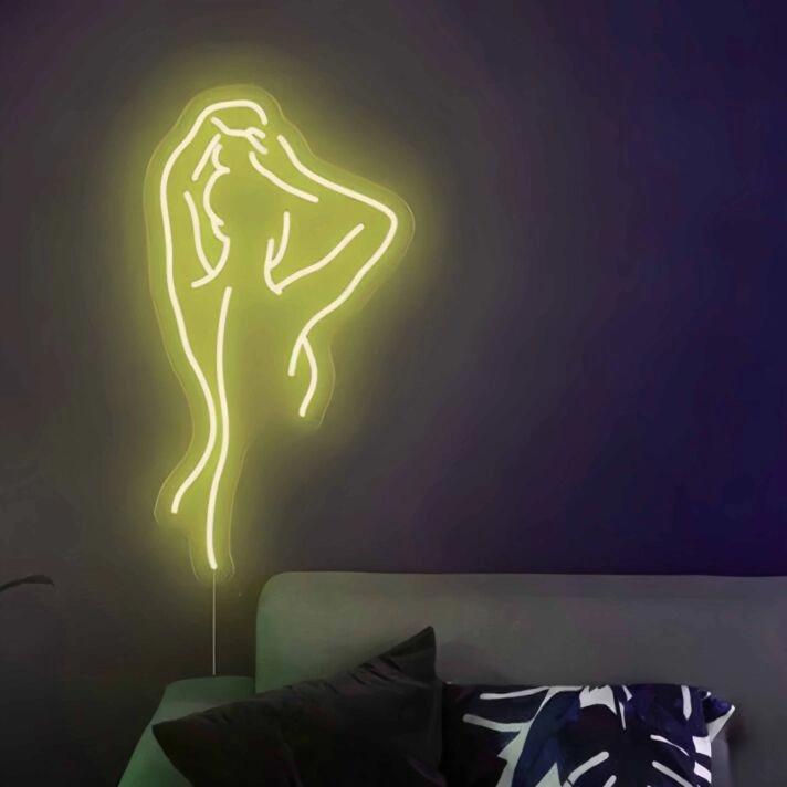 Abstraktes LED Neonschild mit minimalistischer Linienfigur in organischer Körperform als stimmungsvolle Wanddekoration für moderne Wohnräume