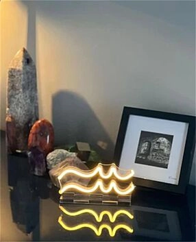 Brighten up your bar, home, and office ambiance with the Wave Line LED Neon Sign.